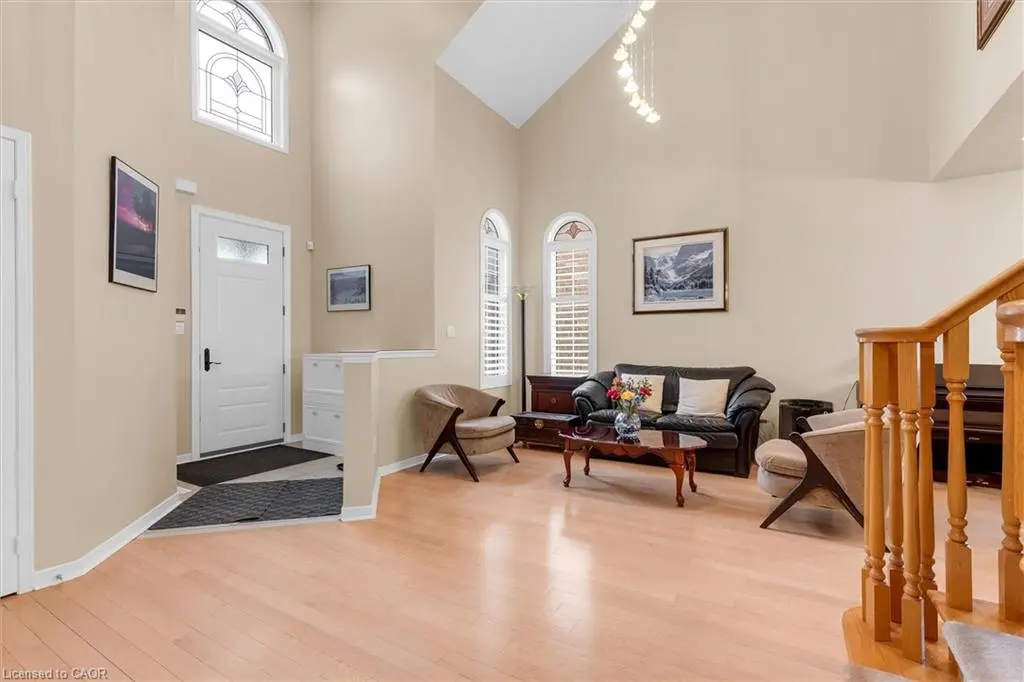 Open concept living area with maple hardwood and gas fireplace